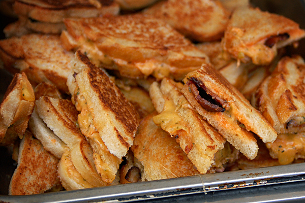 some toasted pieces are stacked in a baking pan