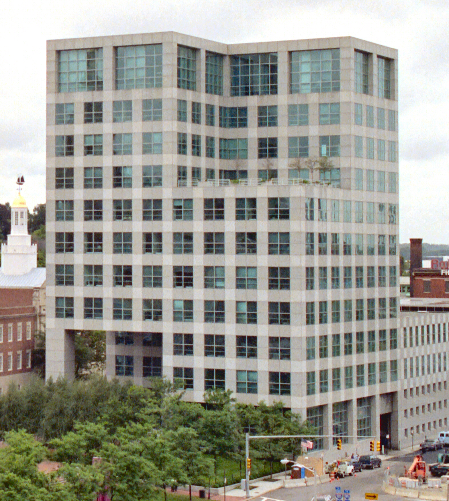 a large white building sitting on the corner of a street