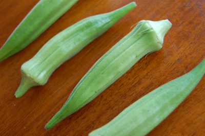 green onions are cut up on a wooden surface