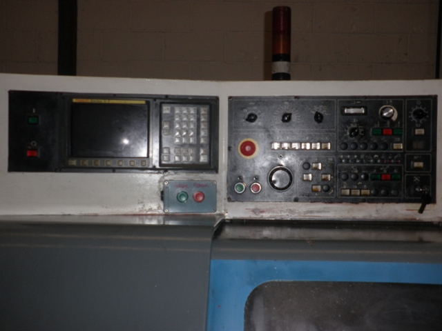 a control panel in a large metal kitchen