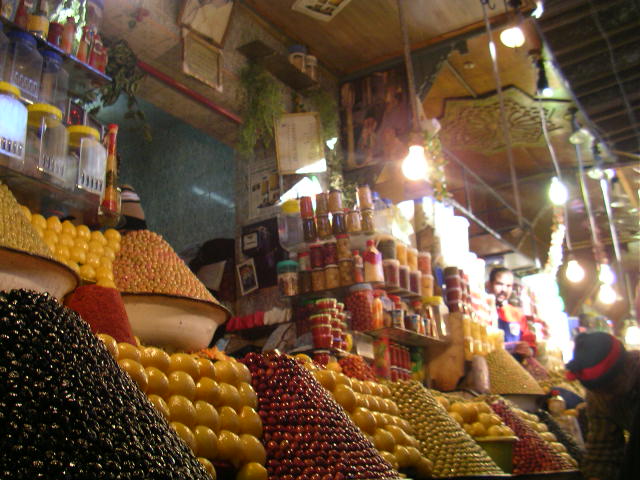 rows of various fruit are shown in a market
