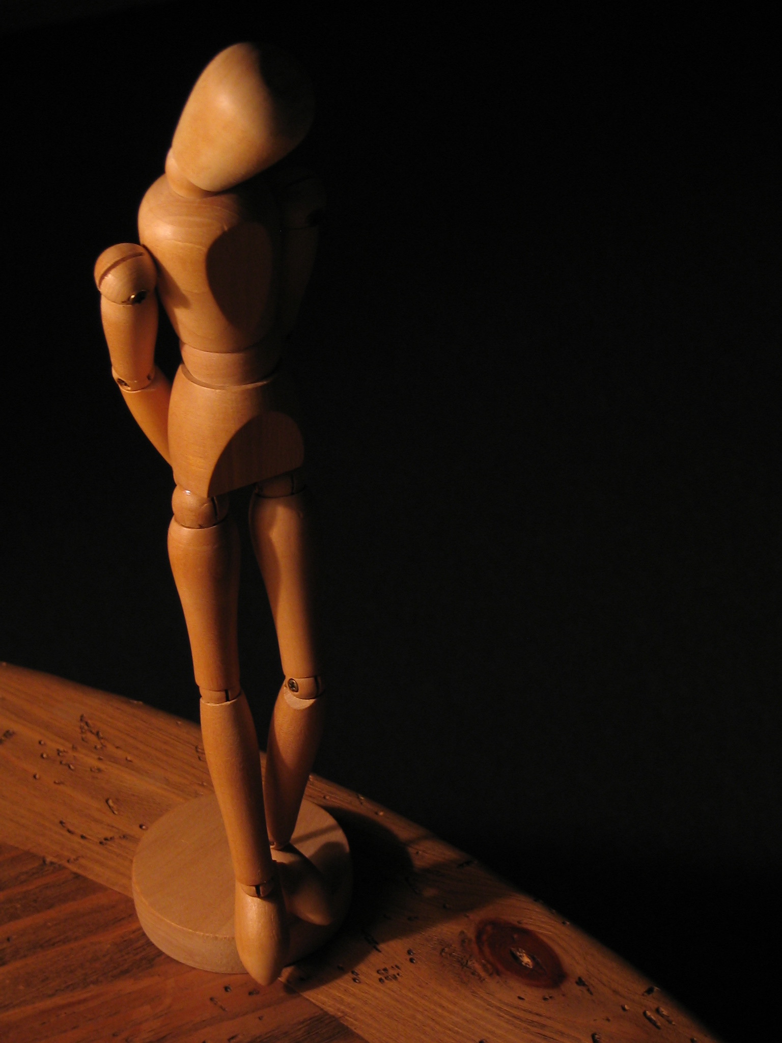 a wooden toy standing on top of a table