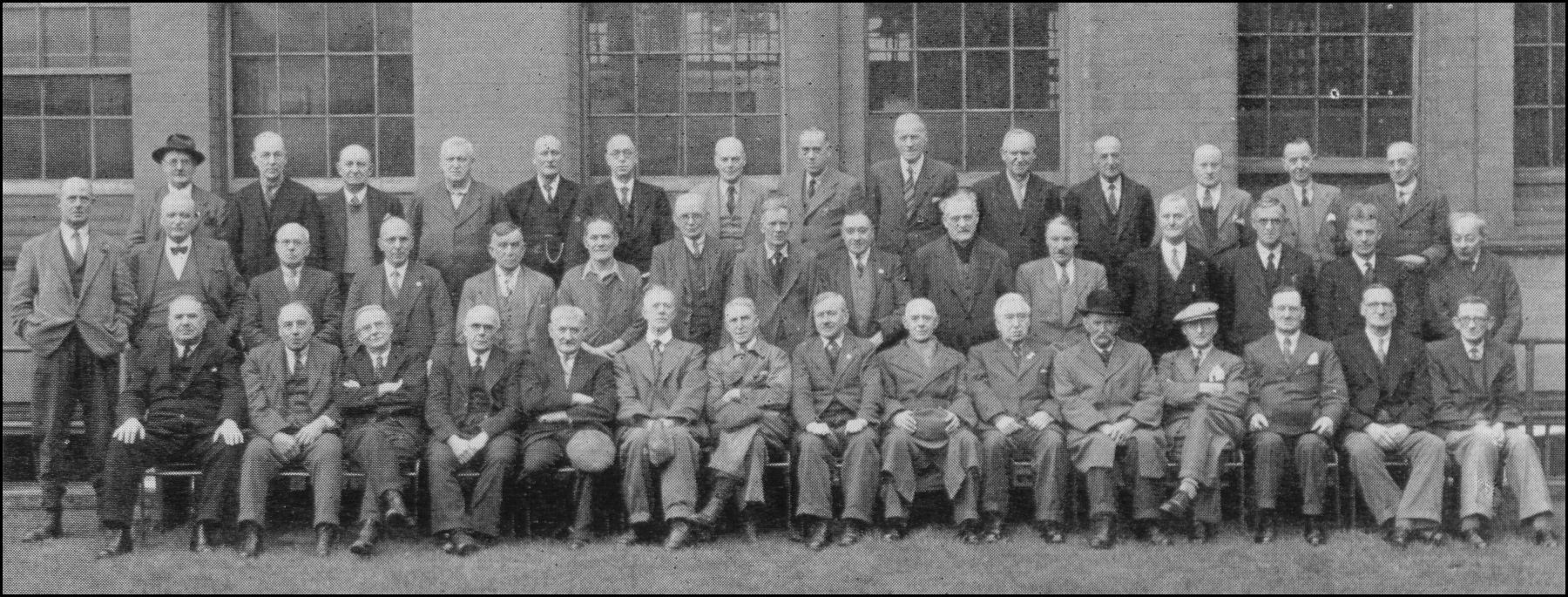 an old picture of a large group of men