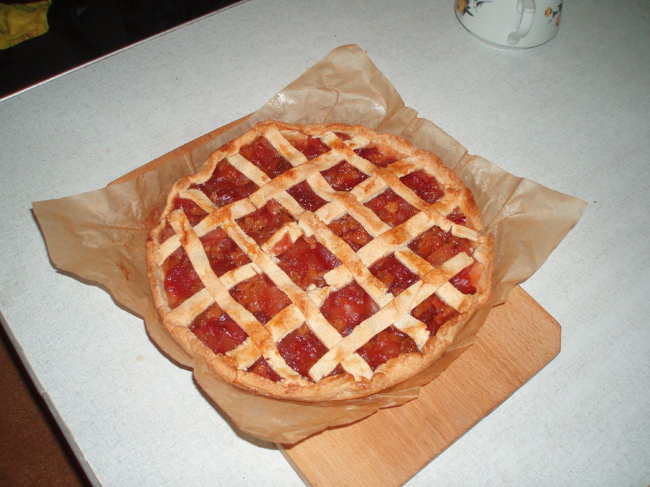 a pizza that is sitting on some brown paper