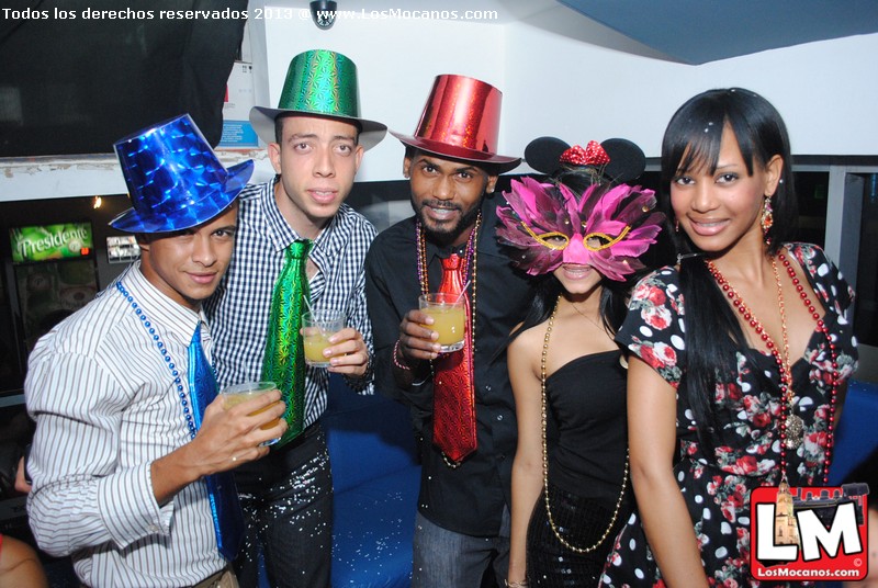 a group of people with party hats standing together