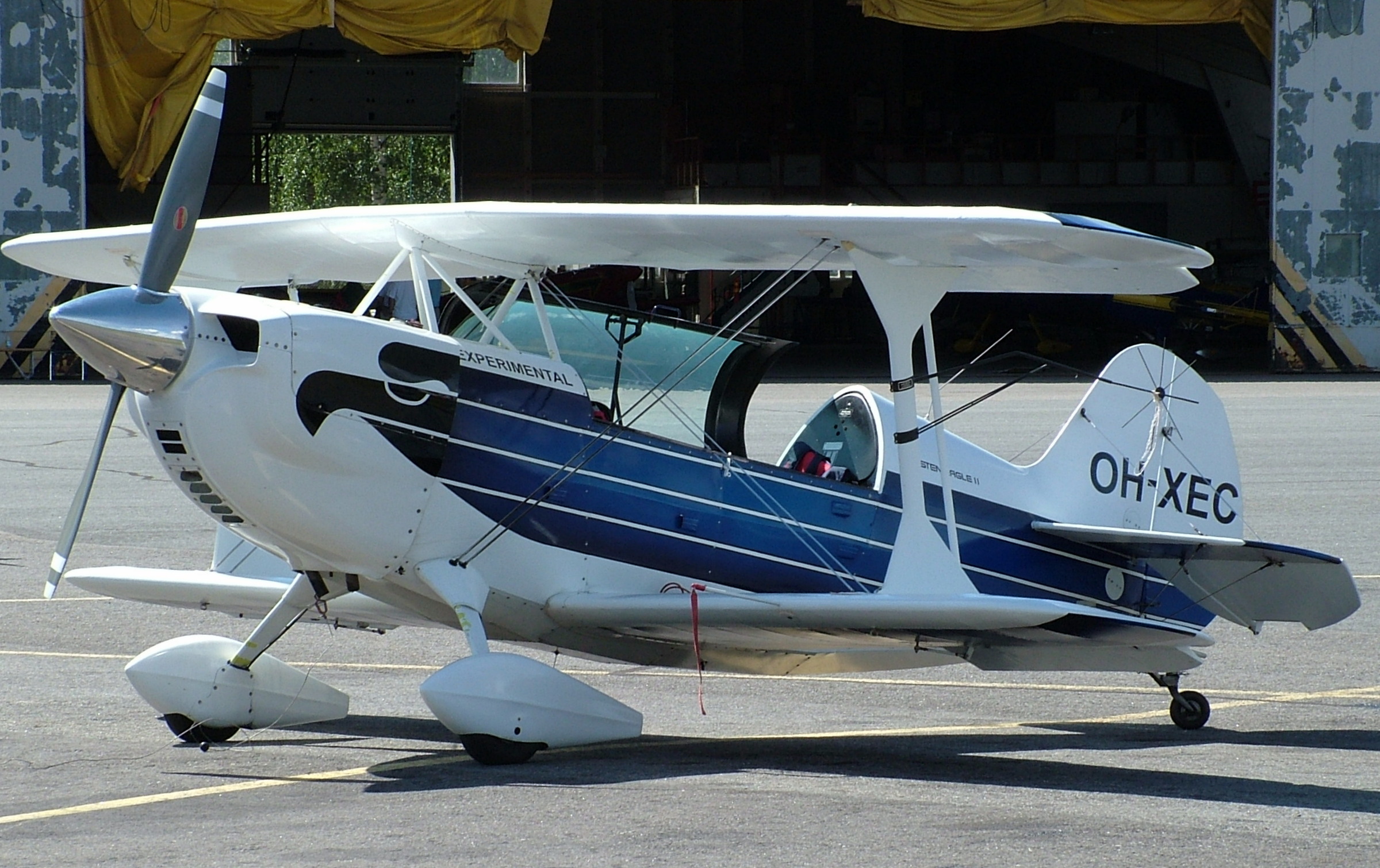 the small airplane has two passengers on the top