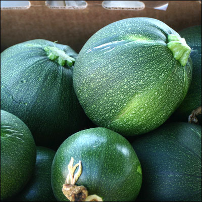 the large green vegetables sit in the box together