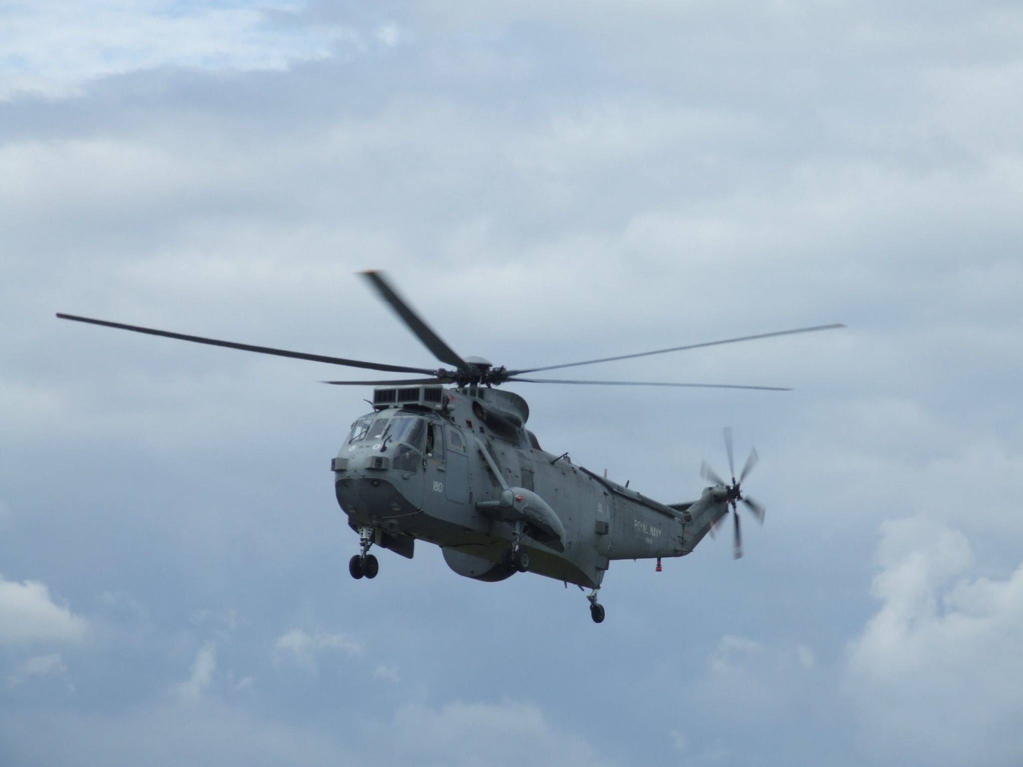 a large army military helicopter flying through the air