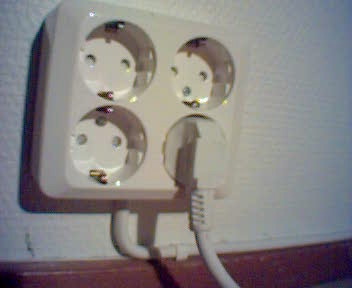 two electrical outlets connected to a power strip
