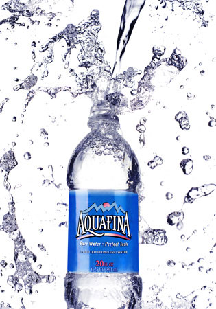 an aquafina bottle of water is shown being dropped into a body of water