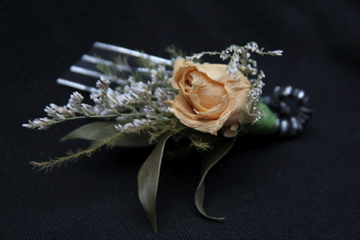 flower arrangement made with artificial flower stems and an artificial flower