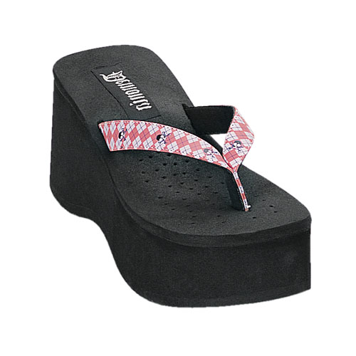 a womans platform sandals that is in the shape of a wedge