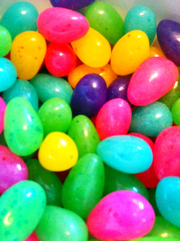 colorful colored easter eggs in a plastic container