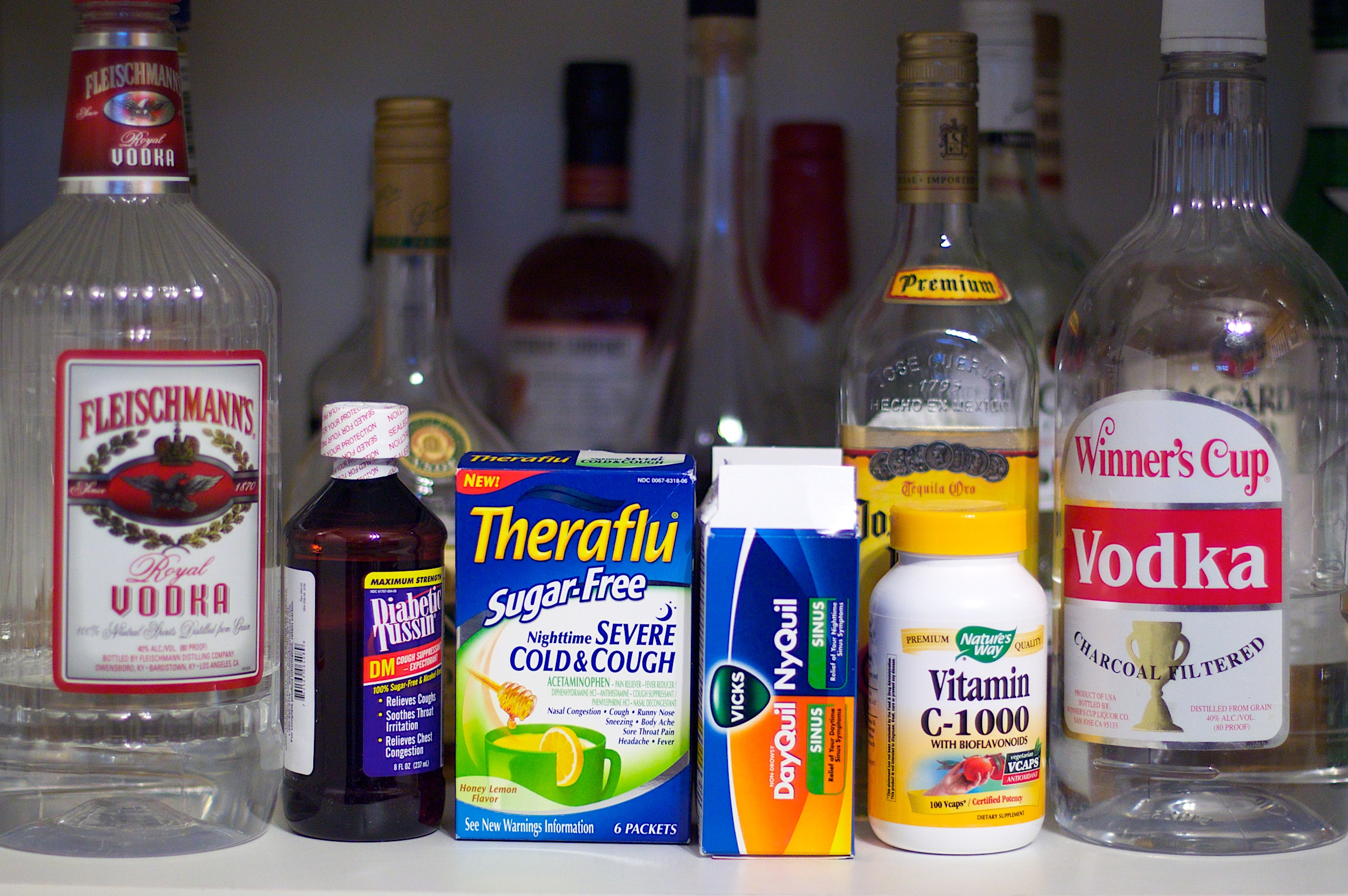 various alcohol and other condiments on a kitchen counter