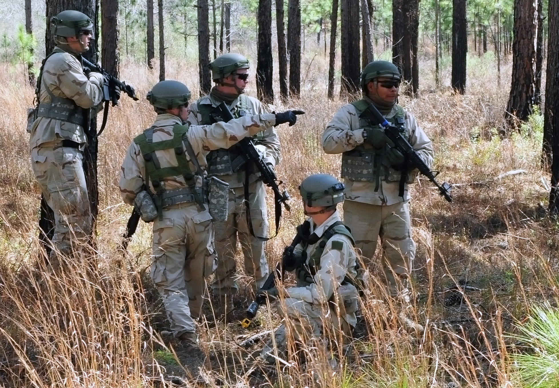 some soldiers and a little boy near the woods