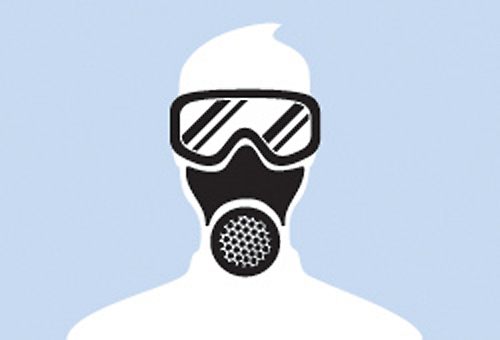 a person wearing a respirator mask and protective gear