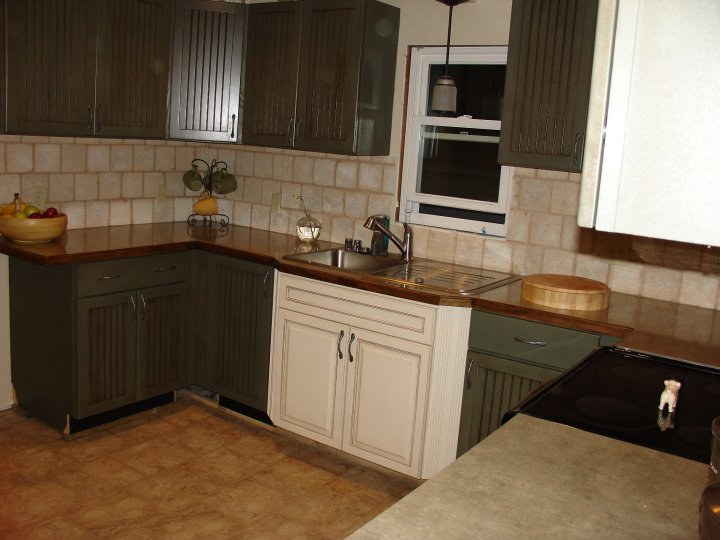 a kitchen filled with cabinets and a sink