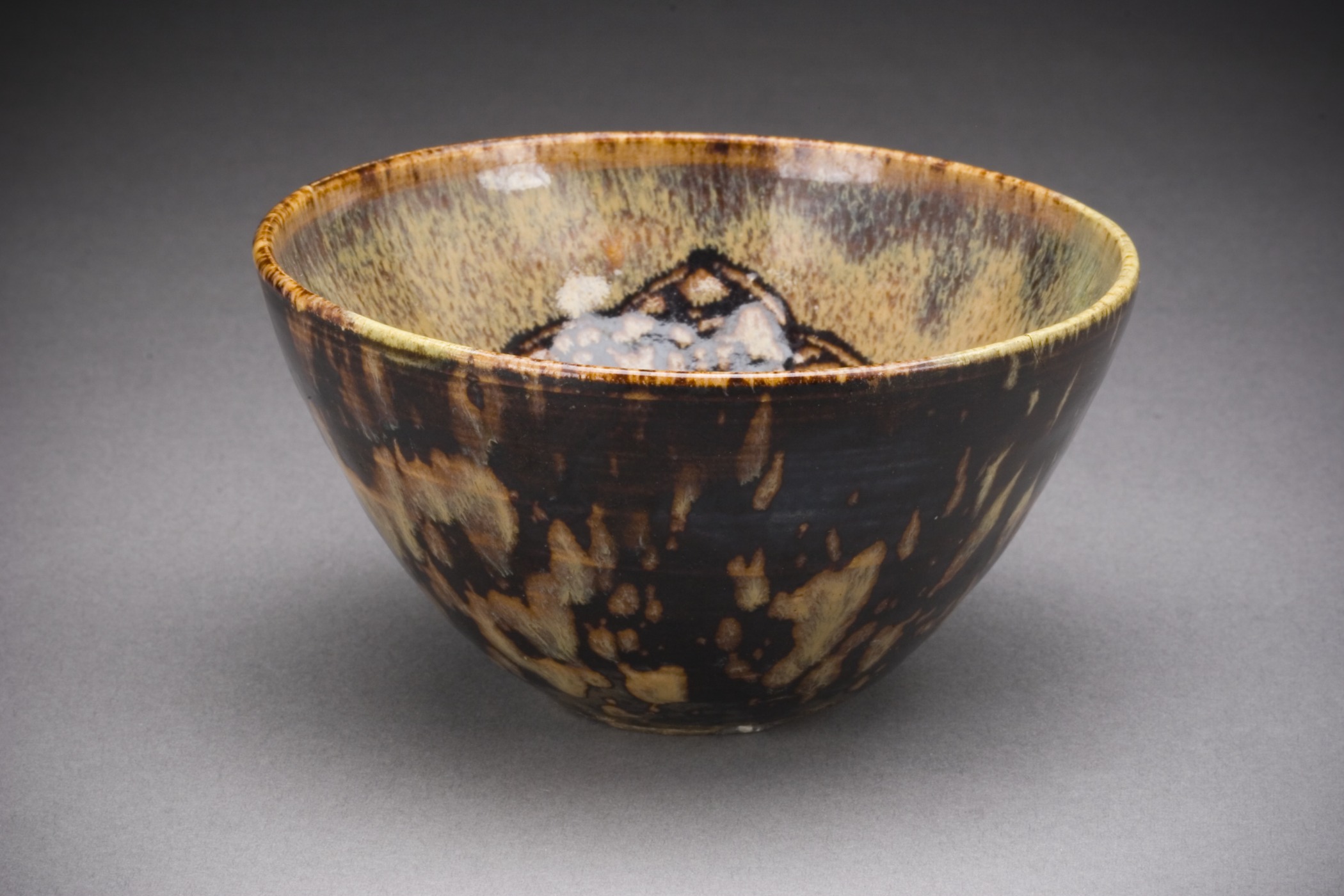 small brown and black bowl on table
