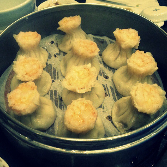 the dumplings in the pot are fried and ready to be eaten