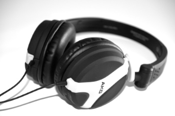 a pair of black and white headphones laying on a table