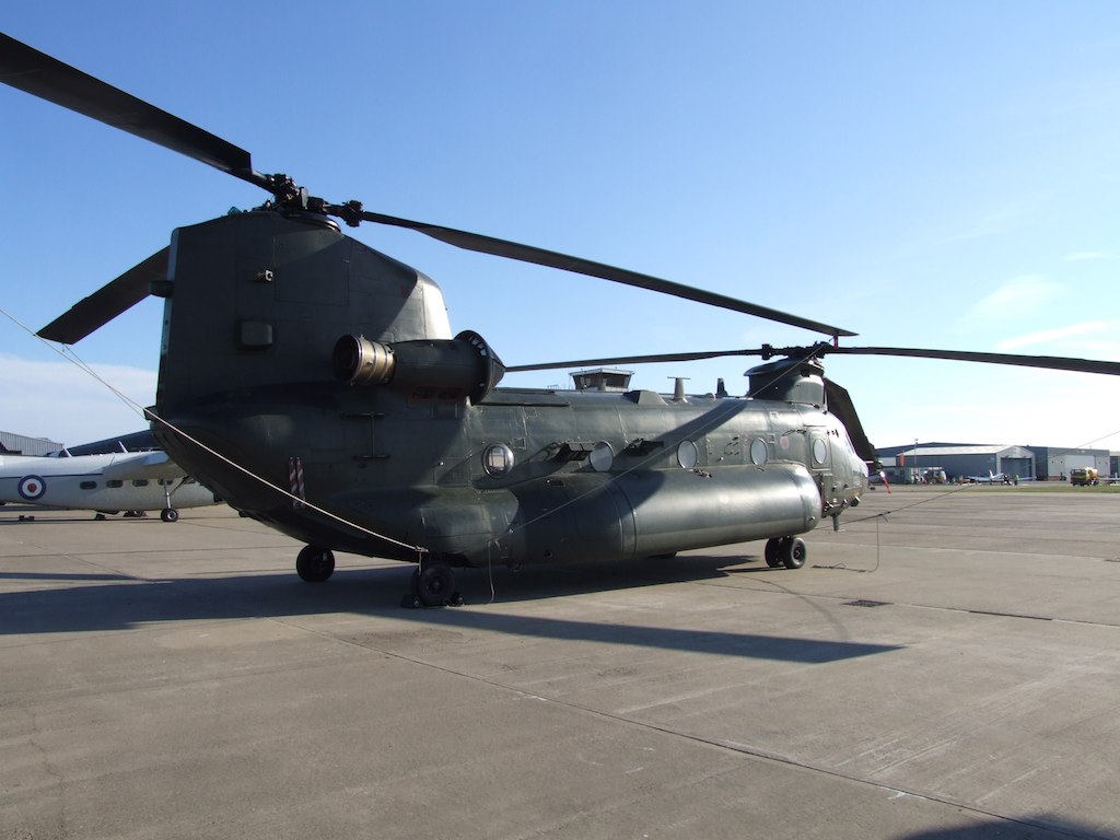 a close up of the front wheel of an army helicopter