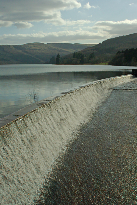 an image of a dam with water coming out from it