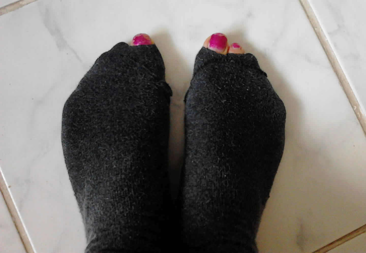 the feet of a person with long, furry socks