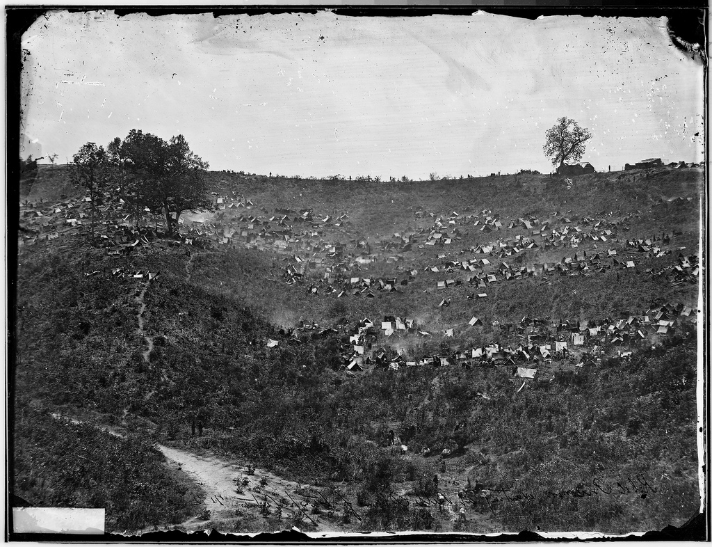 black and white pograph of a large hill in the country