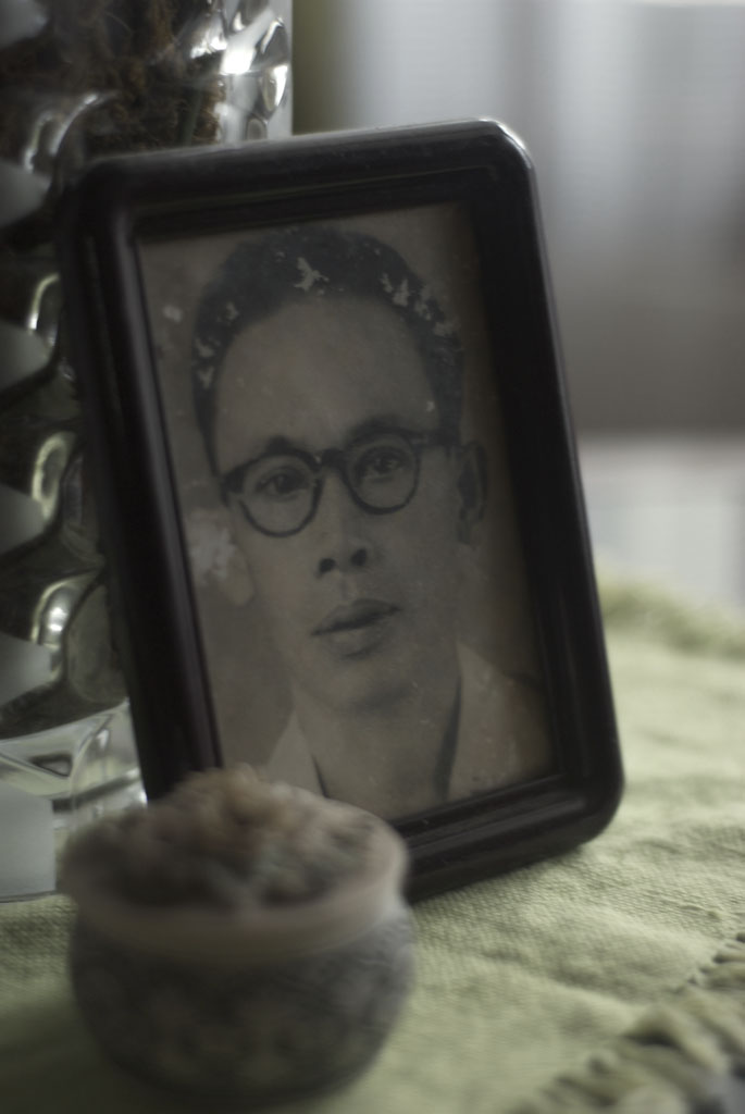 a picture of a young man in glasses and the image of him