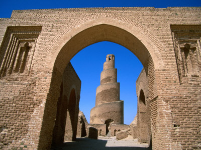 an archway that leads to a large brick building