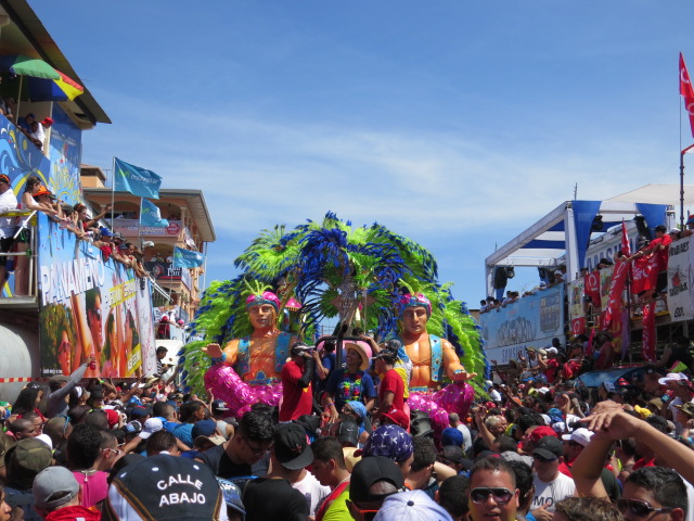 people are seen dressed in colorful outfits as they parade down the street
