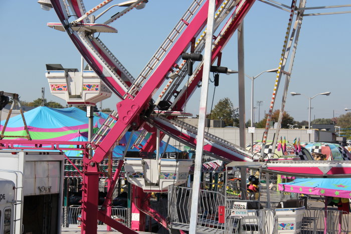 several people ride an amut fair or fair ride