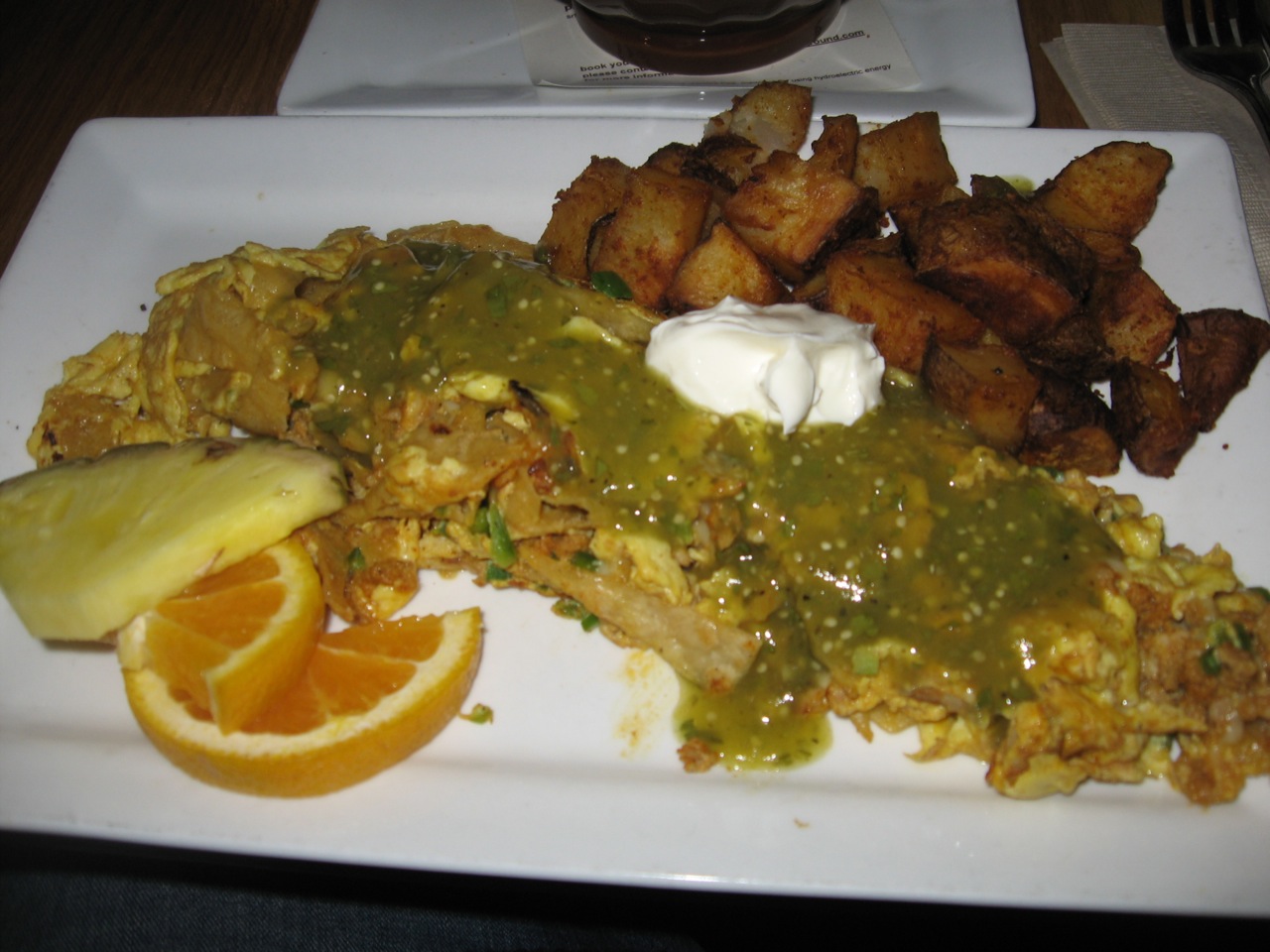 a large white plate with a variety of food