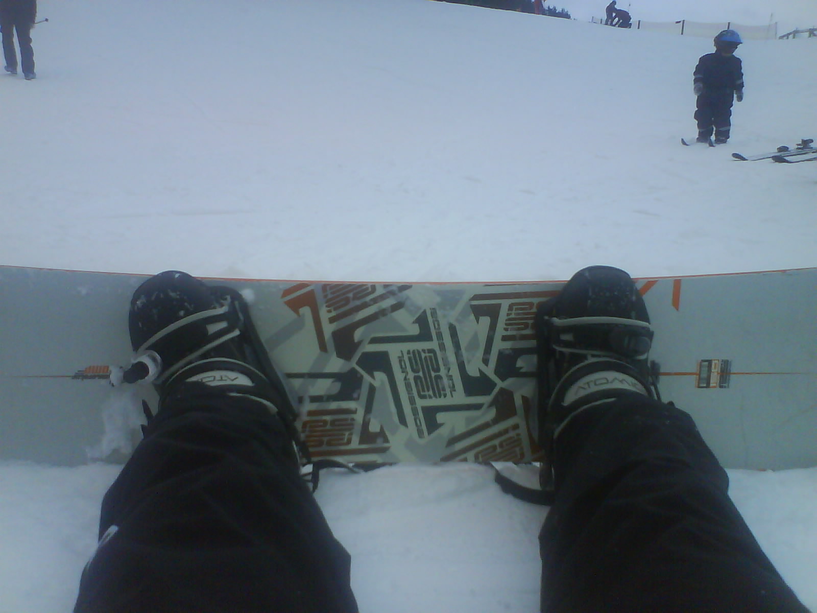 person in snow gear on a snow board