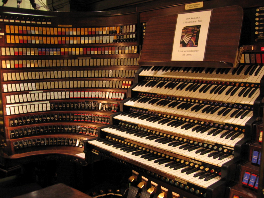 a large pipe organ in a liry filled with lots of books