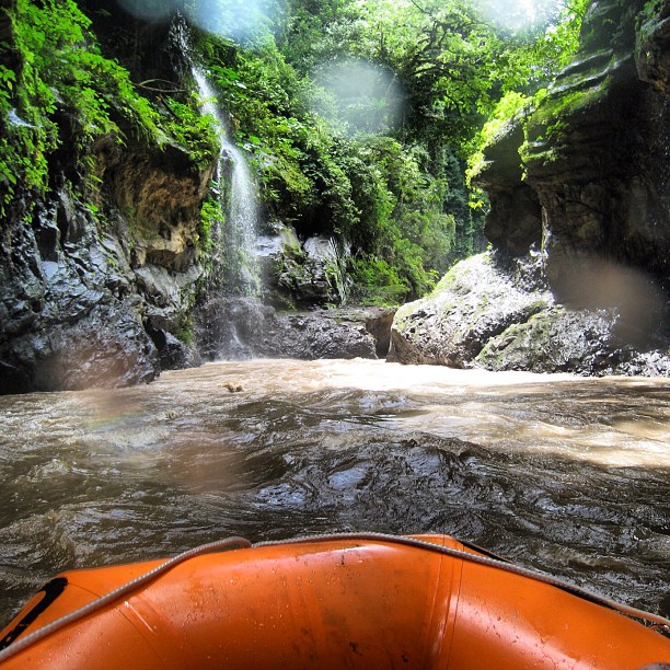 a boat sitting in the middle of a river