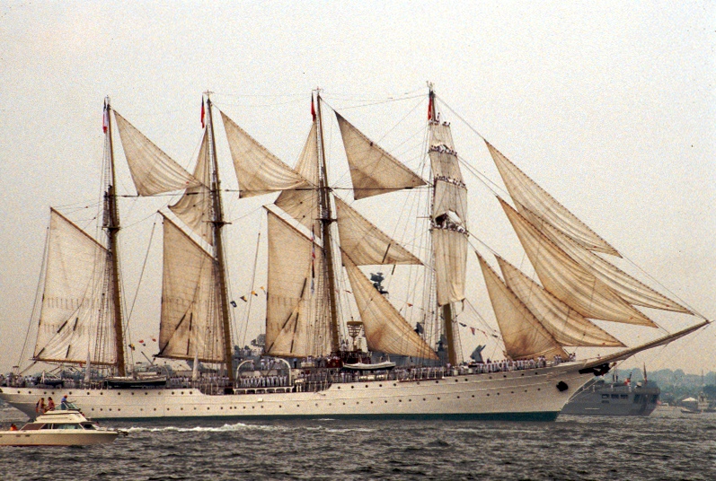 a large sailboat traveling down the ocean