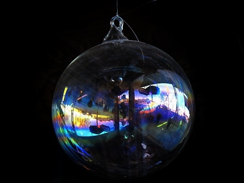 a glass ornament with multiple images in it