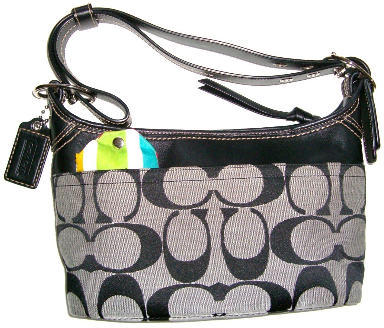 a purse with a patched multi - color handle