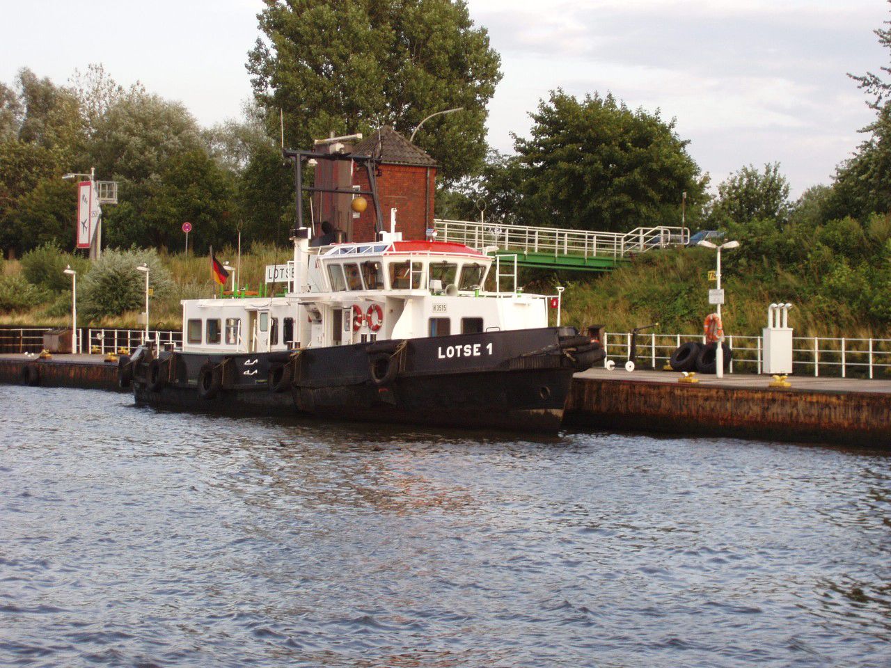 the large boat is floating down the river