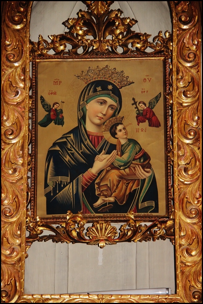 a gold ornate frame with a painting of mary magdalene