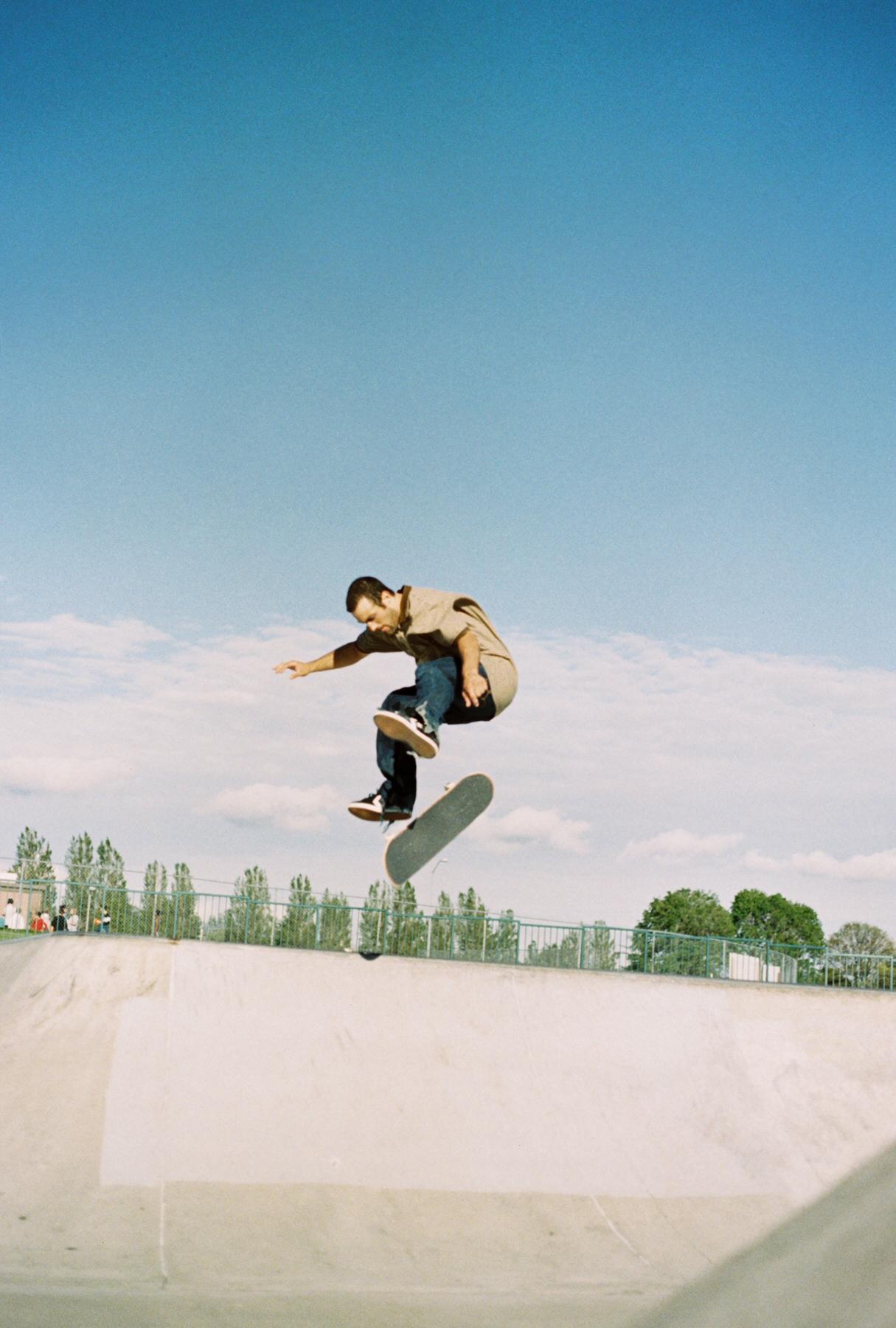 a man jumping a skate board in the air