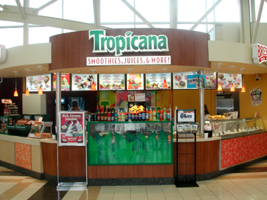 a deli is shown with a large sign and display on the side of it