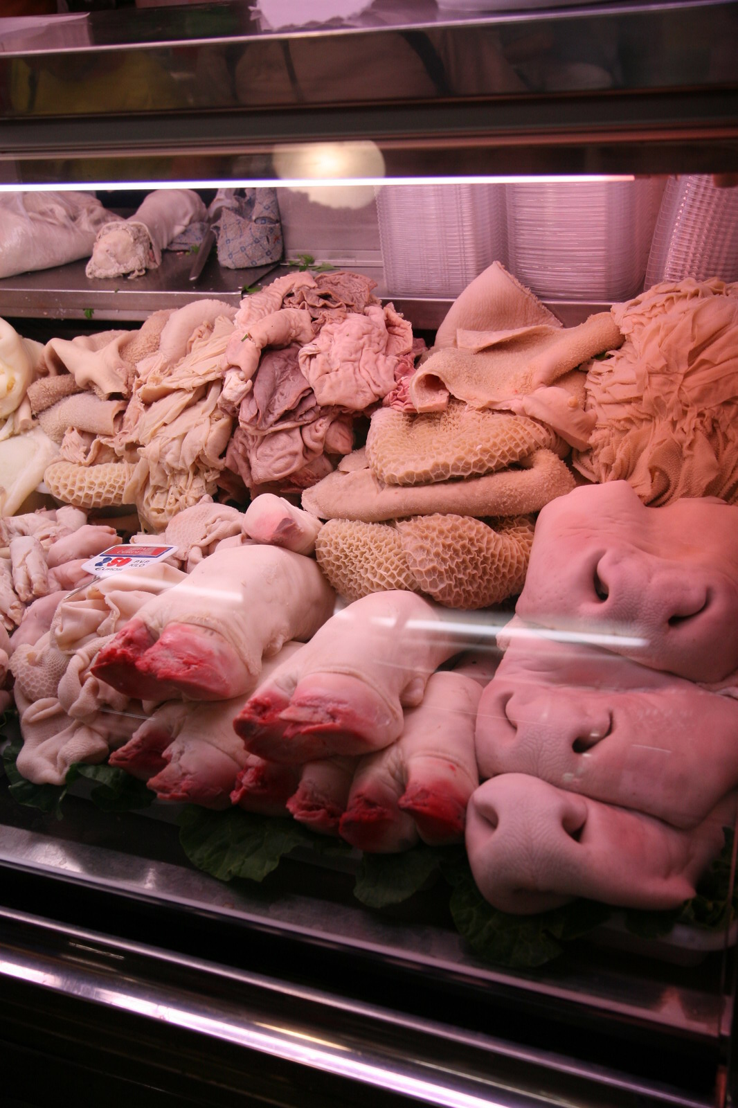 a display case with lots of meat