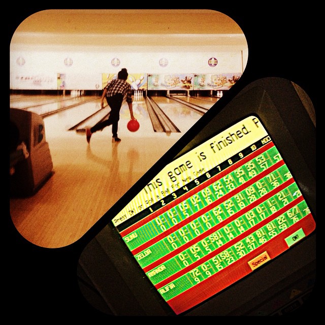 a picture and a person standing in the bowling alley
