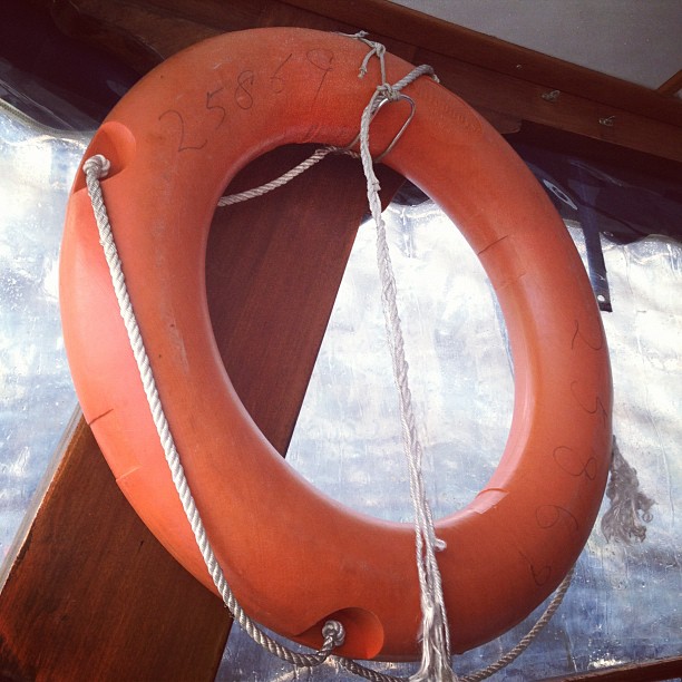 a life preserver hanging on the side of a boat