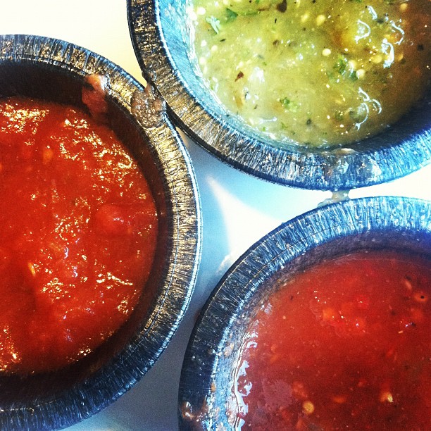 three bowls of different types of stew and sauces