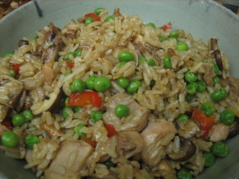 a close up of a plate of food with rice and peas