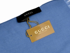 blue gucci long sleeved top with metallic tag