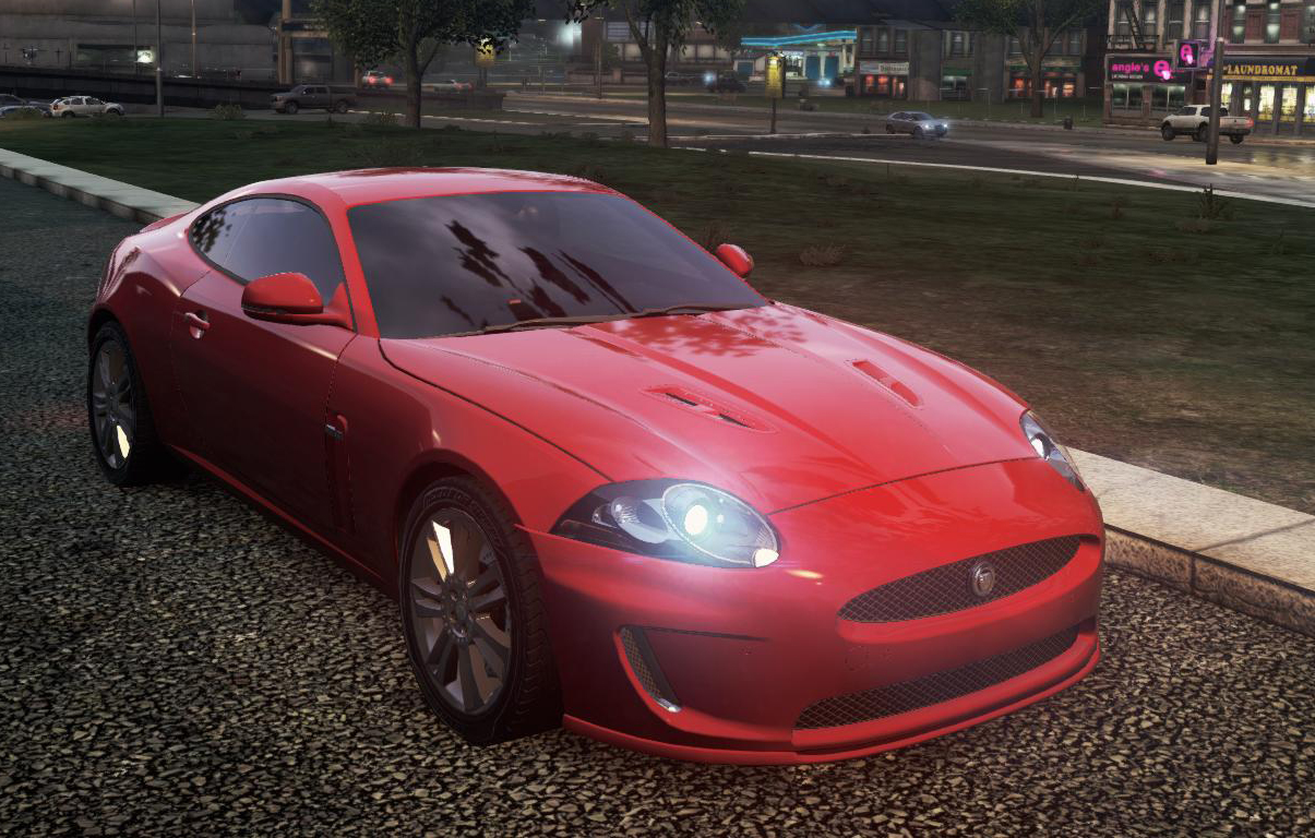 a red sports car parked on the side of a road